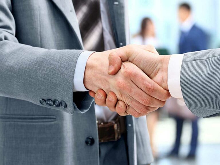 Closeup of two businessmen shaking hands